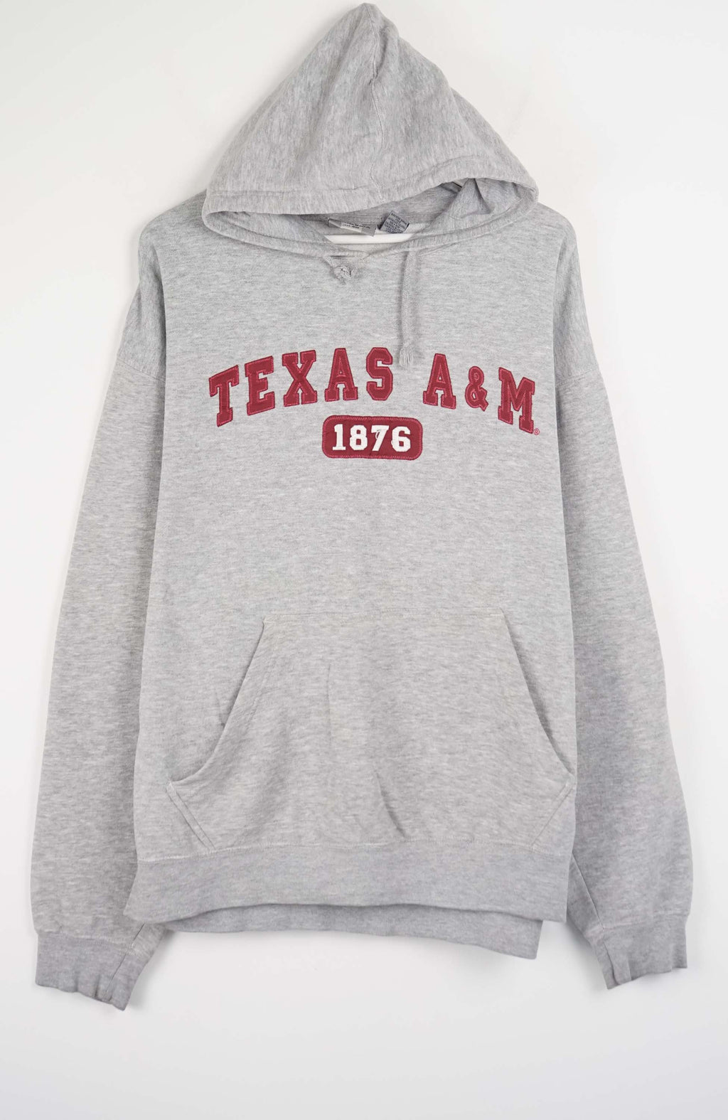 Gray hoodie with 'Texas A&M 1876' text on a white background