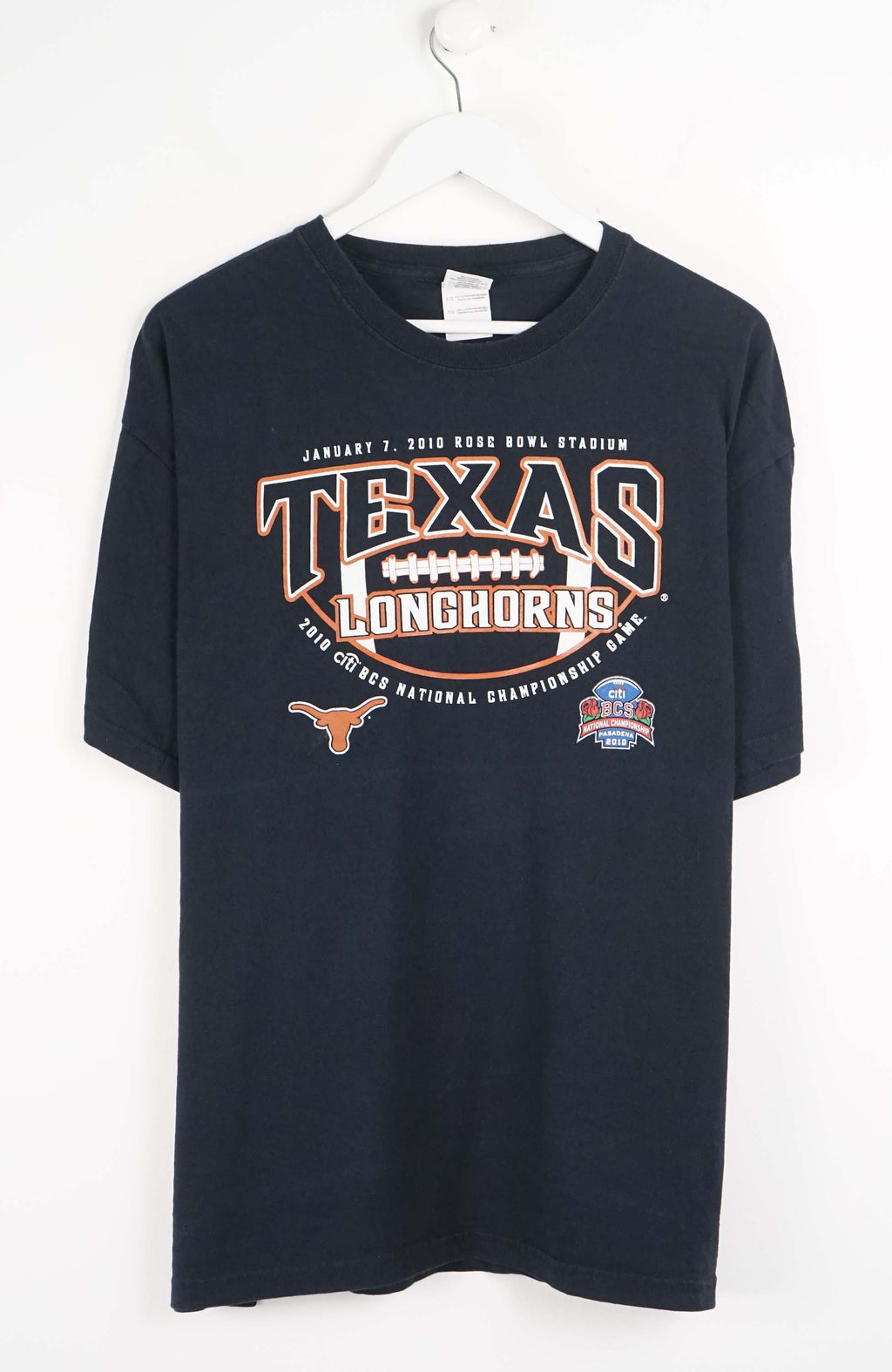 Black t-shirt with 'Texas Longhorns' text and graphics on a white background