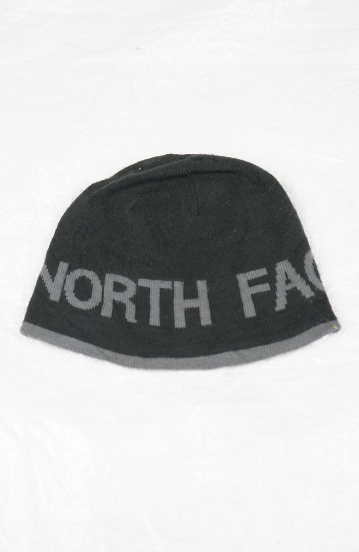 Gray beanie with 'The North Face' logo on a white background