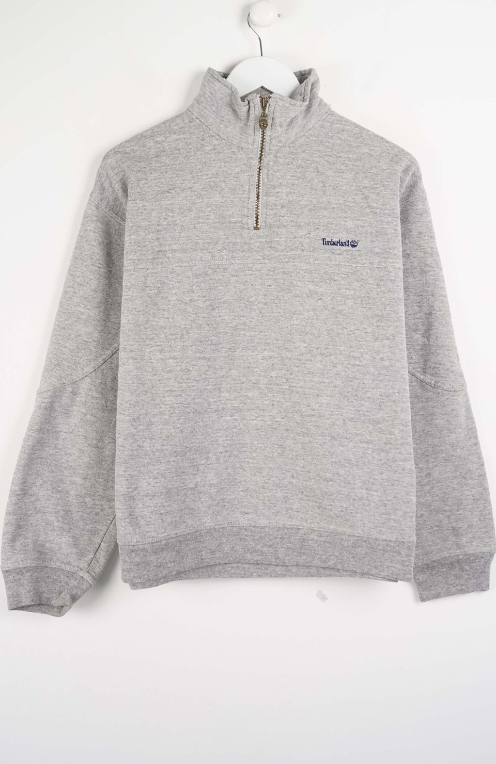 Gray pullover with a brand logo on a white background