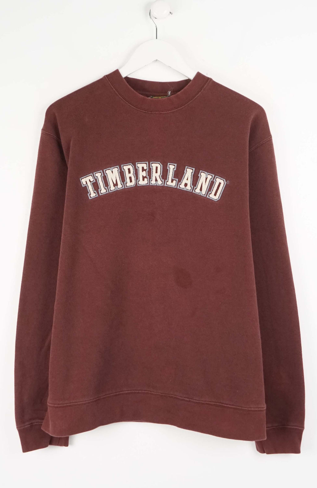 Maroon sweatshirt with 'TIMBERLAND' logo on a white background