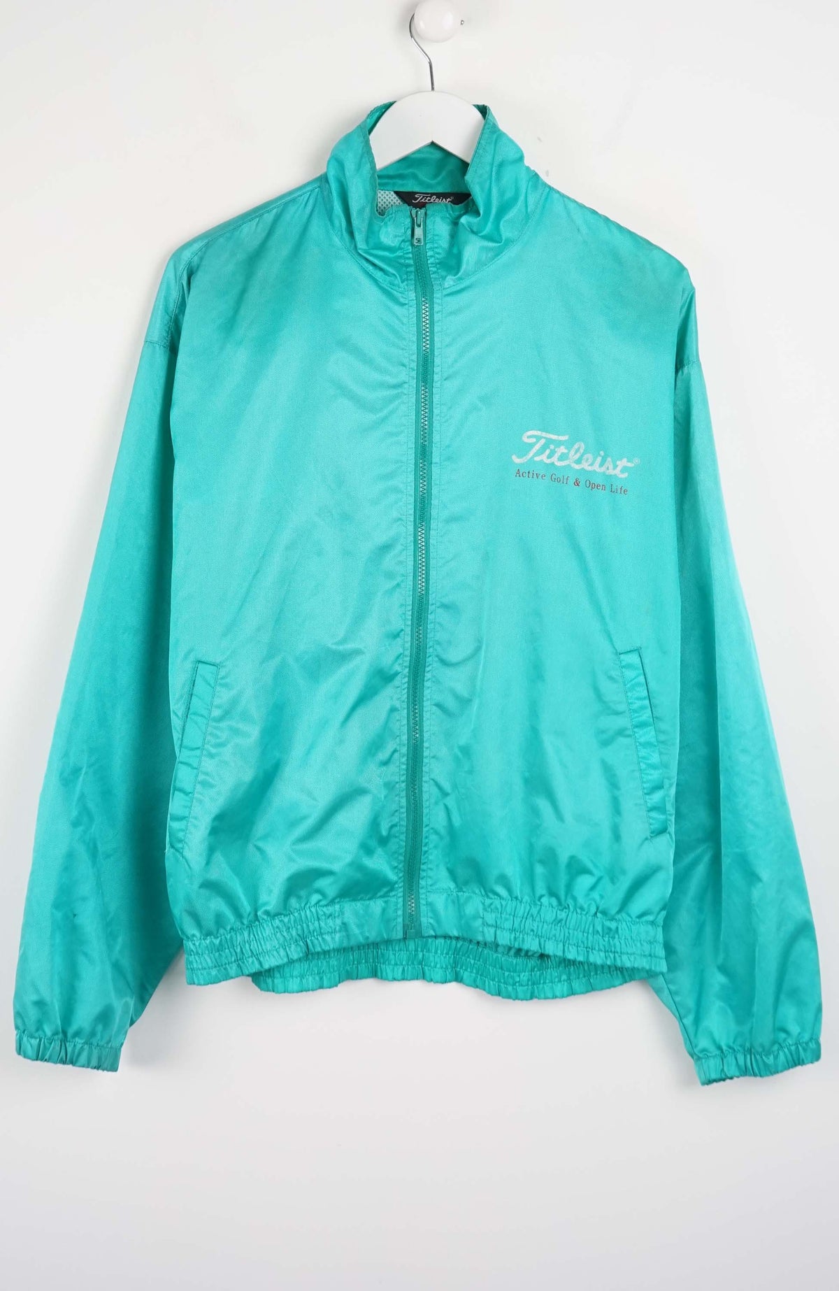Teal jacket with a brand logo on a white background