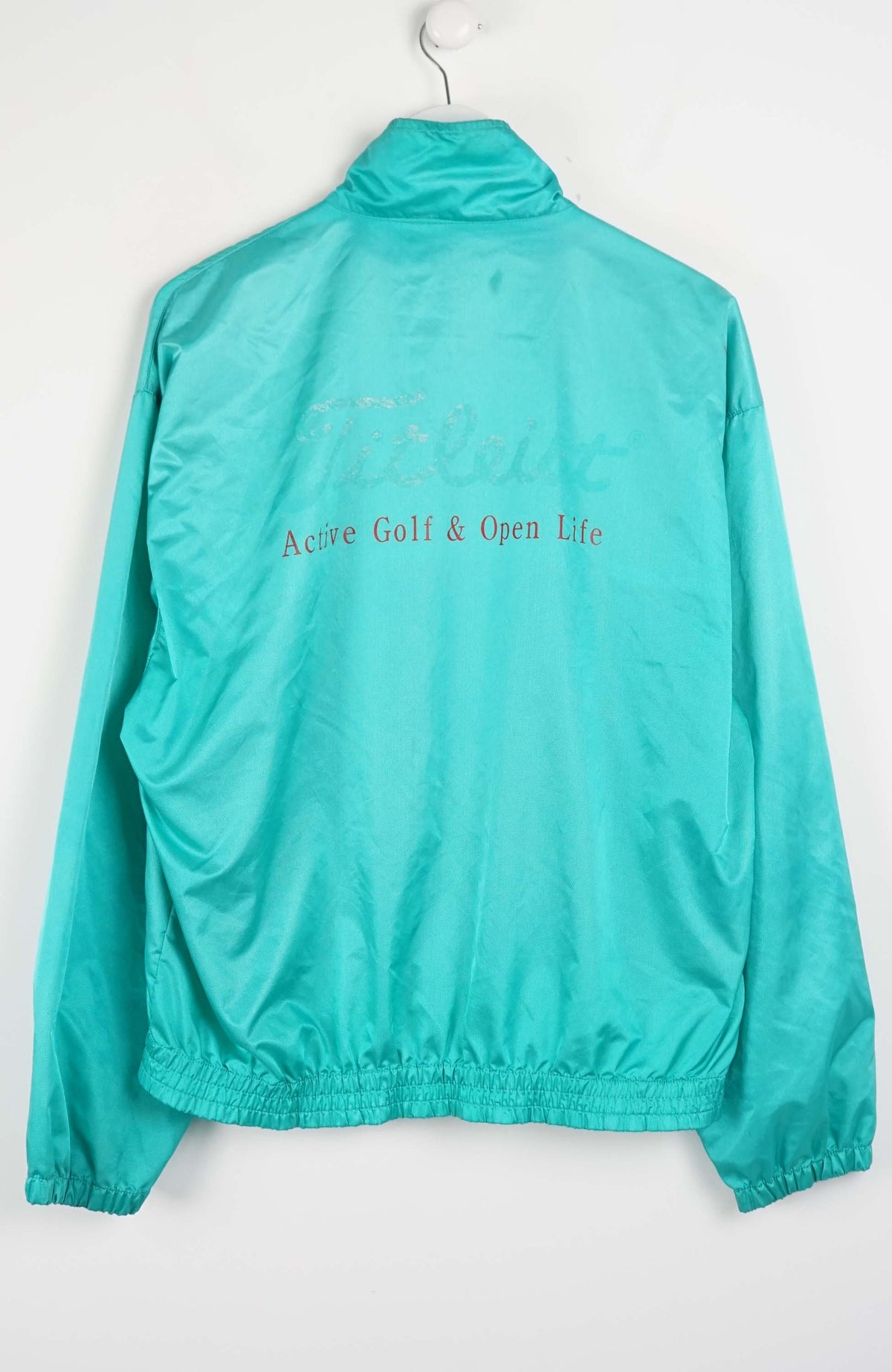 Teal jacket with text on a white background