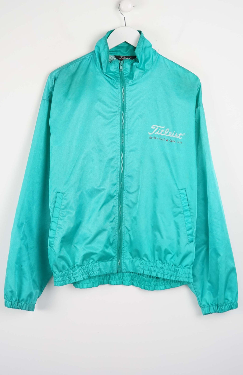 Teal jacket with a brand logo on a white background