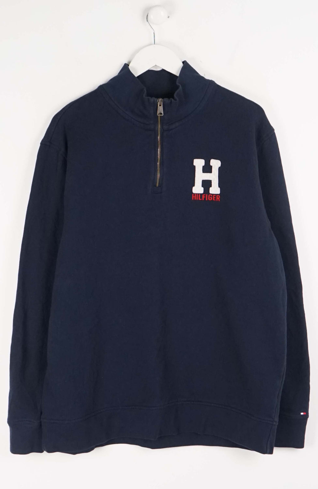 Navy blue sweatshirt with a logo on a white background