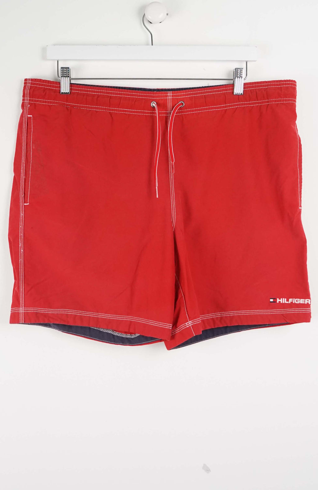 Red shorts with a brand logo on a white background