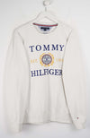 White Tommy Hilfiger sweatshirt on a hanger against a white background