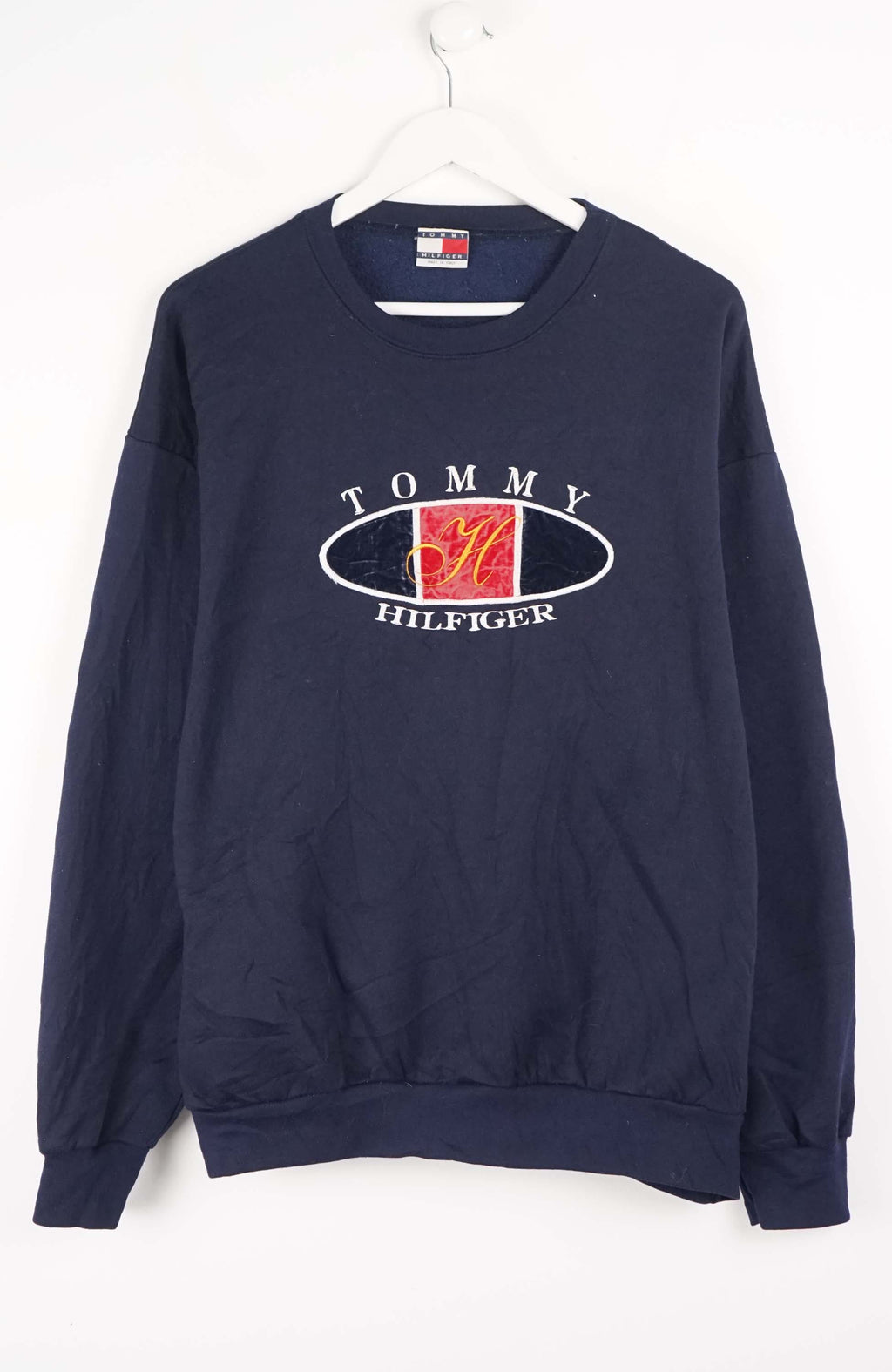 Navy blue Tommy Hilfiger sweatshirt on a white background