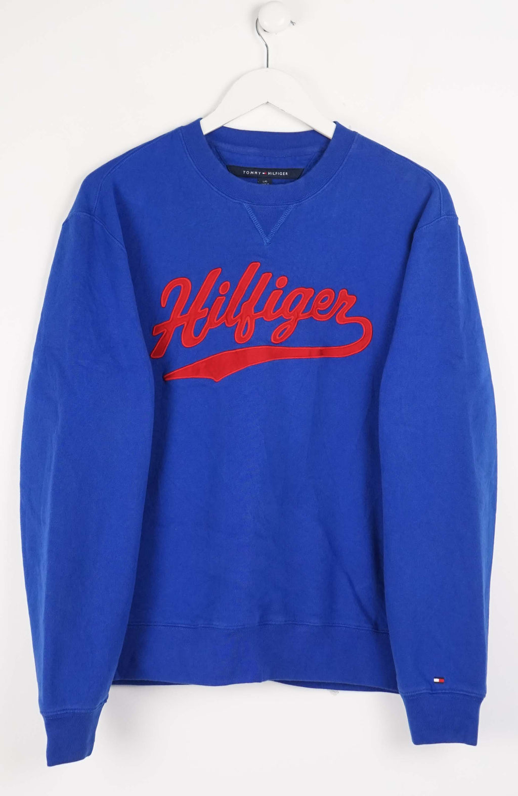 Blue Tommy Hilfiger sweatshirt with red logo on a white background