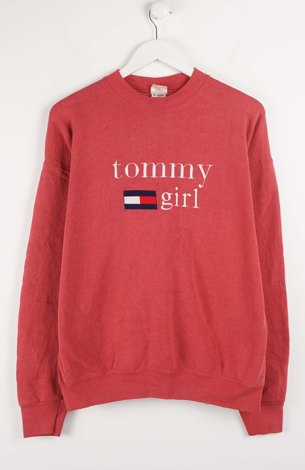 Red sweatshirt with 'Tommy Girl' text and logo on a white background