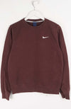 Brown sweatshirt with Nike logo on a white hanger