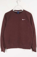 Brown sweatshirt with Nike logo on a white hanger