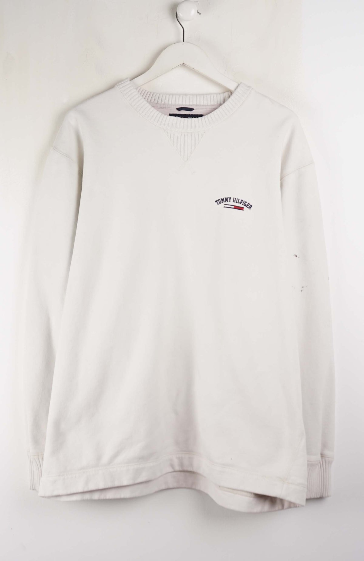 White long-sleeve shirt with a logo on a white background