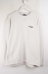 White long-sleeve shirt with a logo on a white background