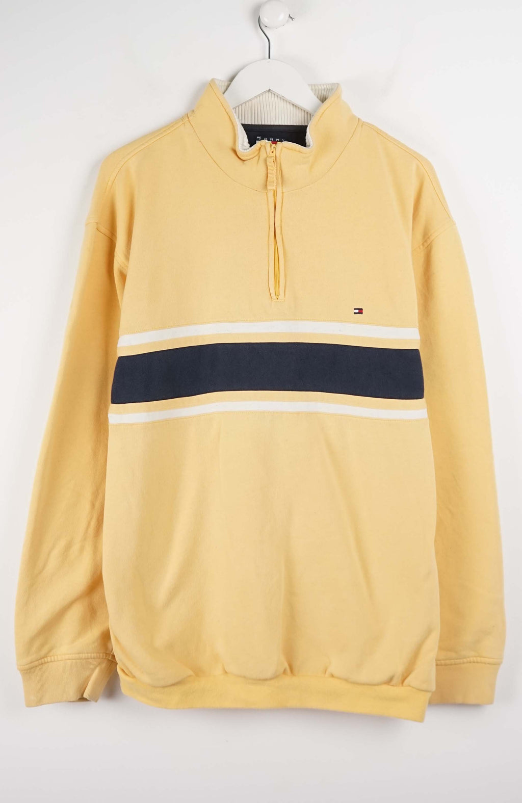Yellow hoodie with a black and white stripe on a white background