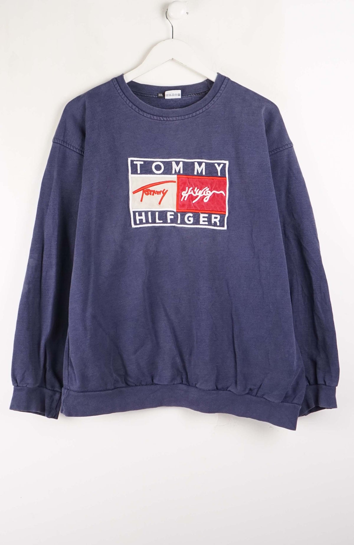 Blue Tommy Hilfiger sweatshirt on a white background
