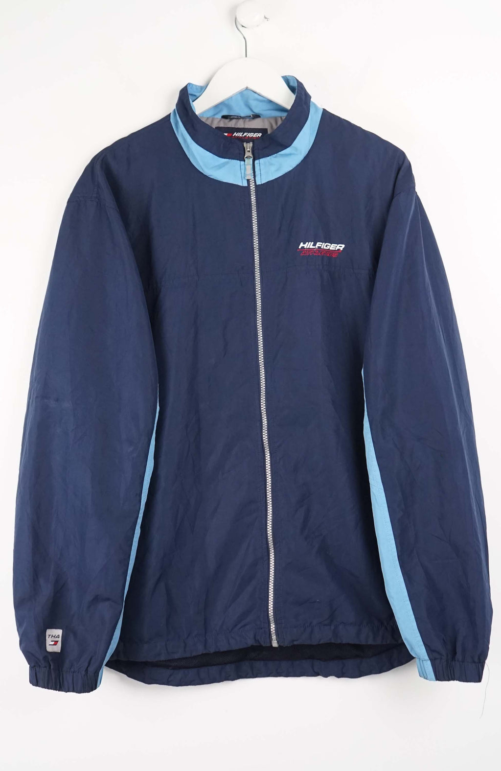 Navy jacket with light blue trim on a white background