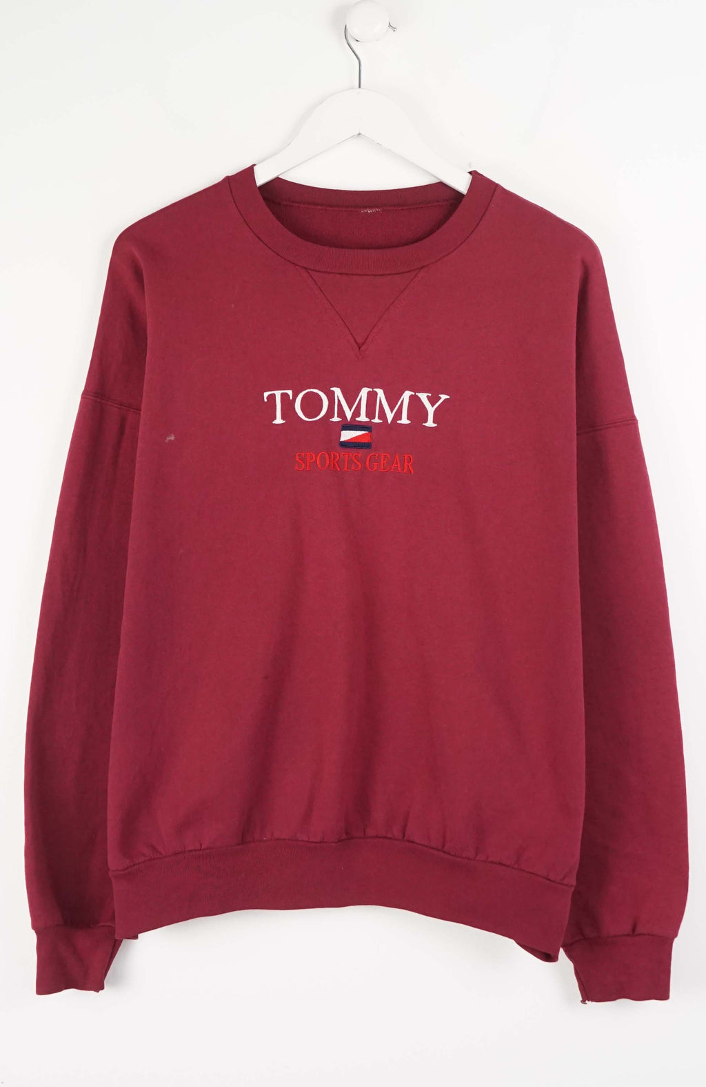 Maroon sweatshirt with Tommy Hilfiger logo on a white background
