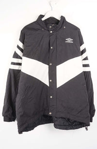 Black and white jacket with striped sleeves on a hanger against a white background