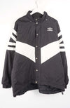 Black and white jacket with striped sleeves on a hanger against a white background
