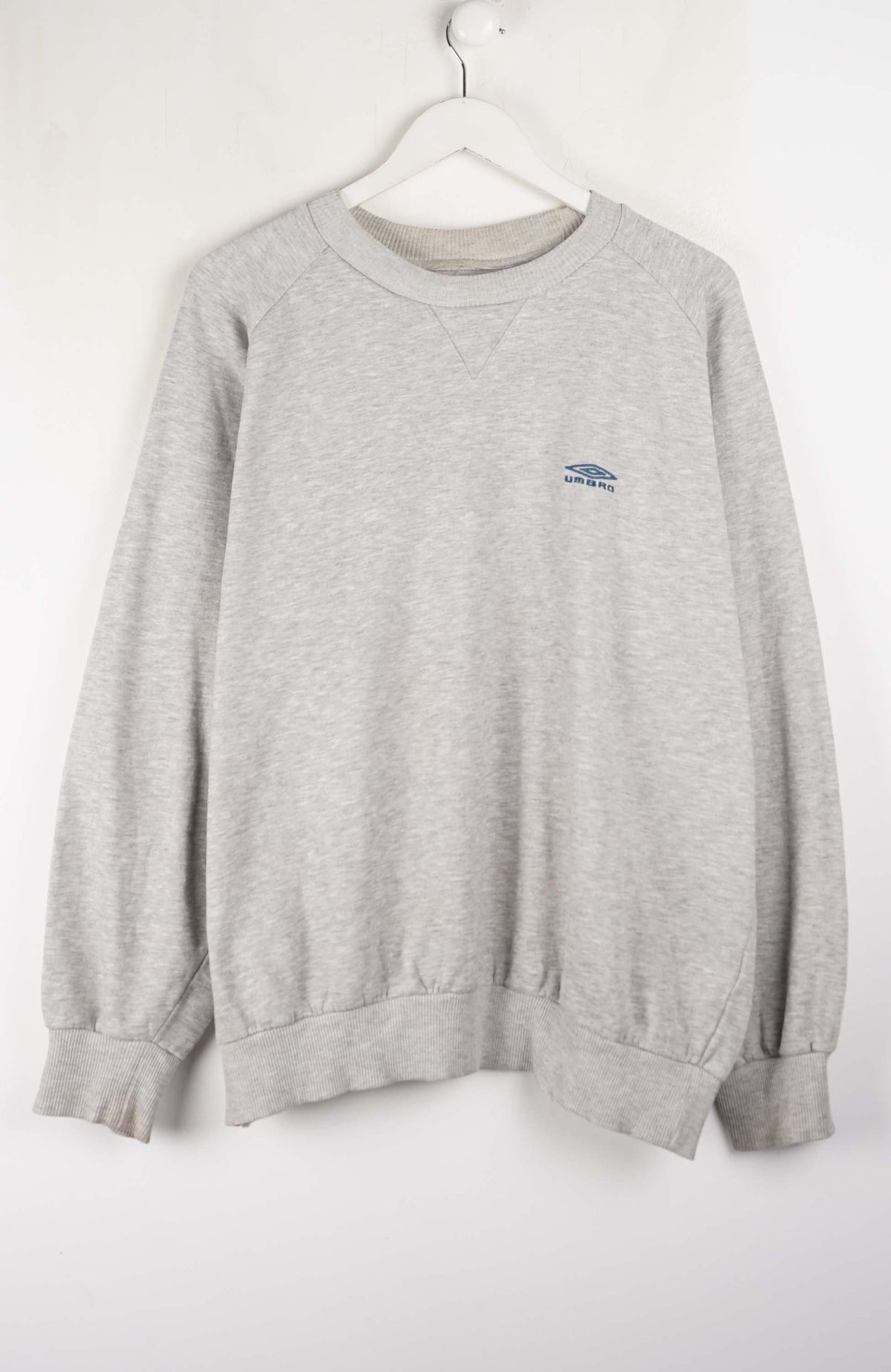 Gray sweatshirt with a small logo on a white hanger