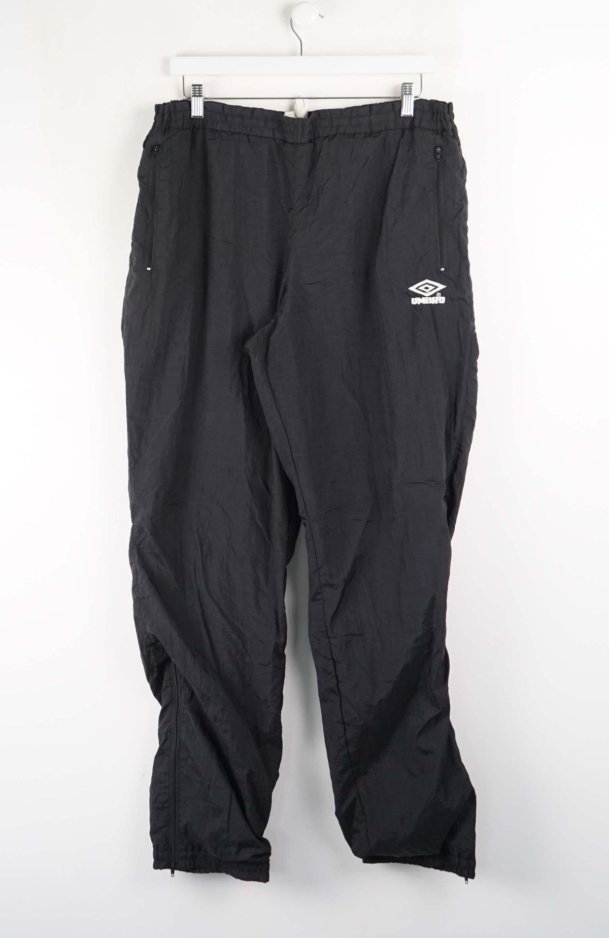 Black pants with a logo on a white background