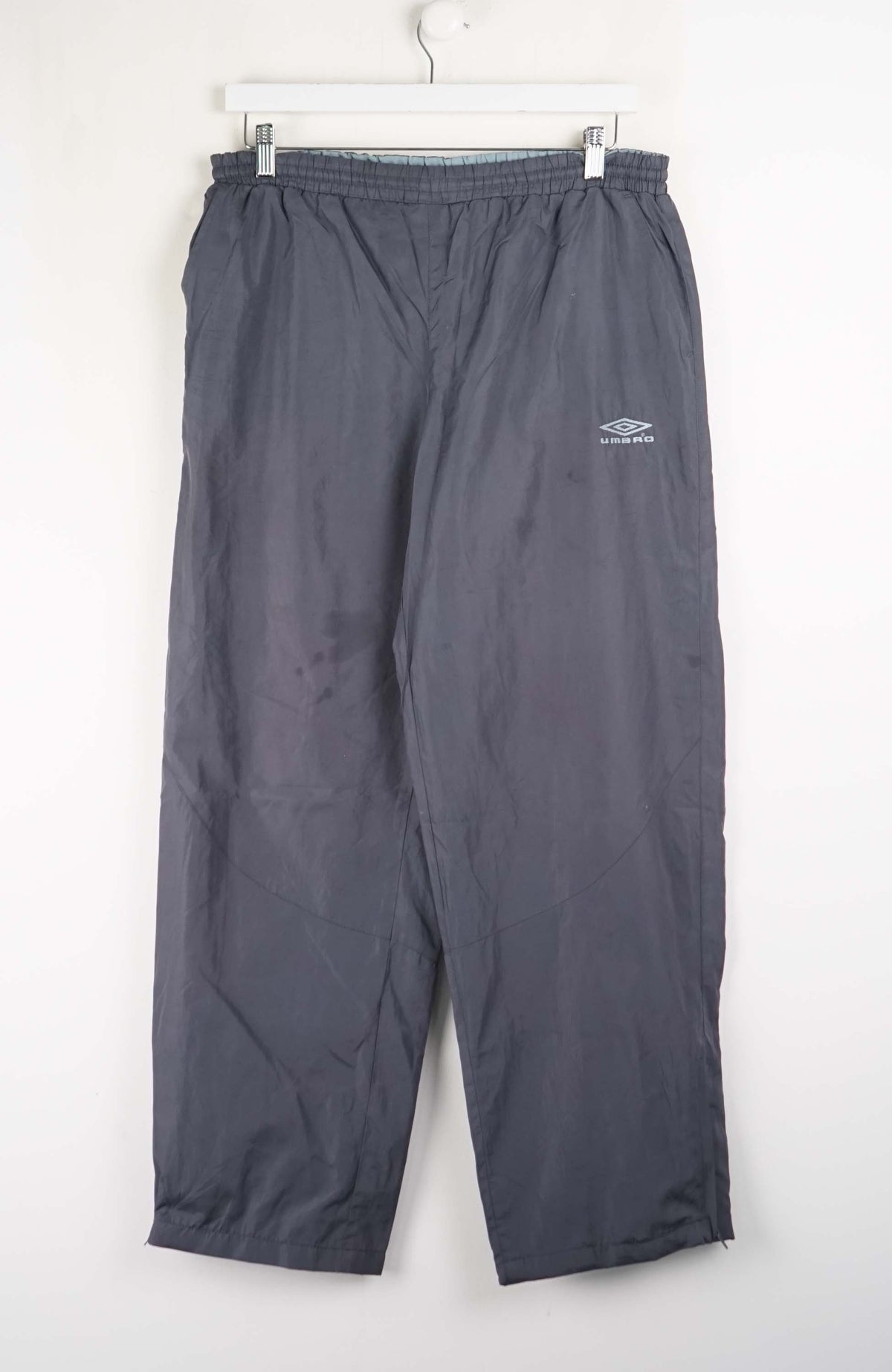 Gray pants with a brand logo on a white background