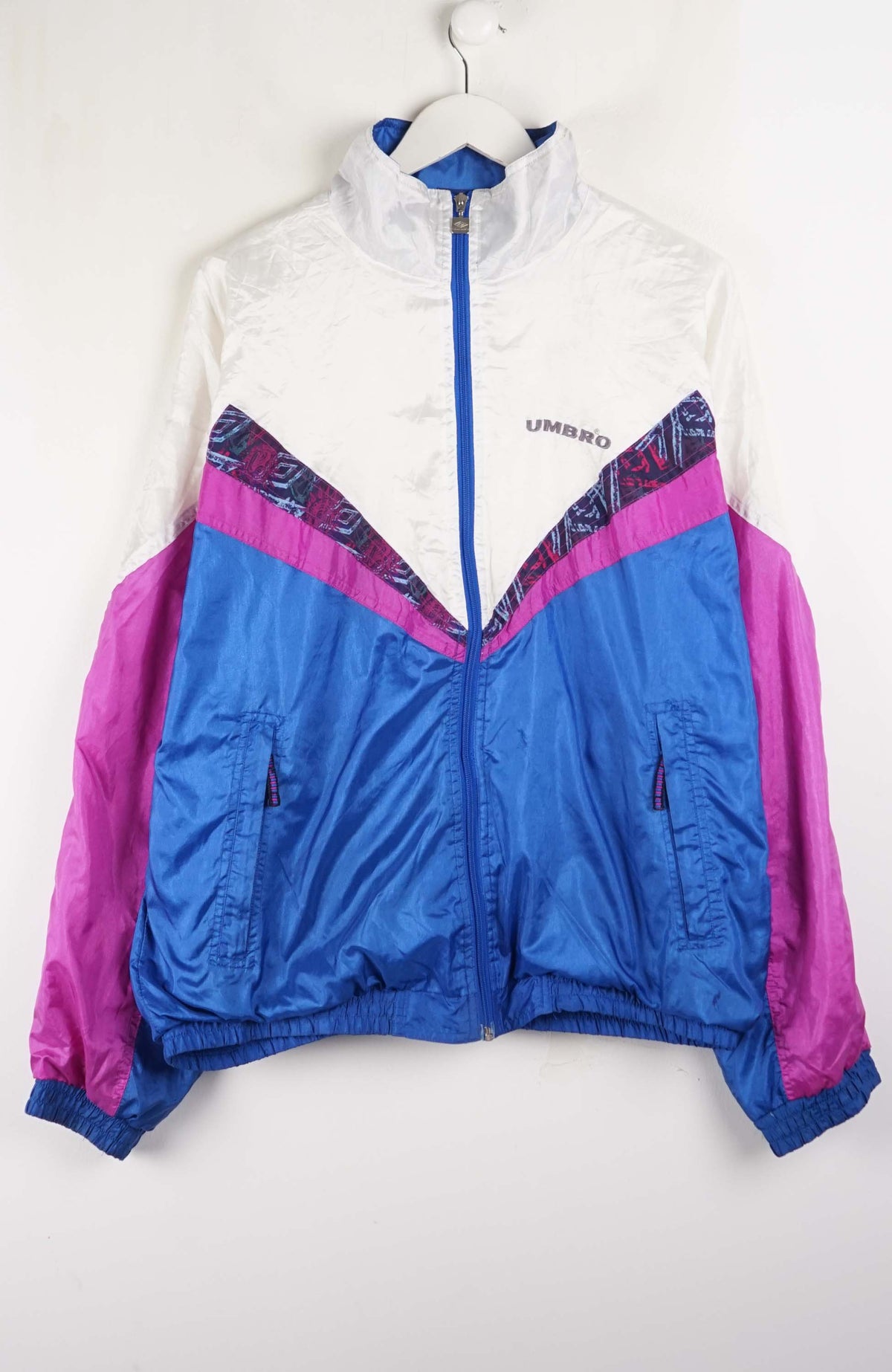 Multicolored jacket with a brand logo on a white background