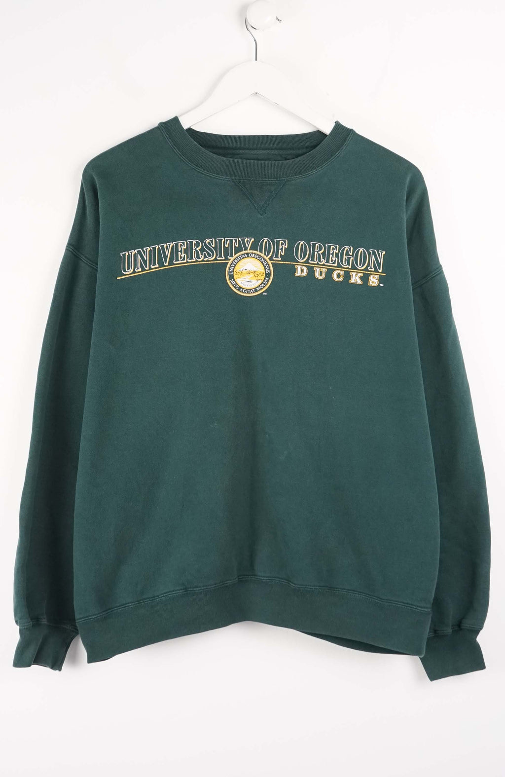 Green sweatshirt with 'University of Oregon Ducks' text on a white background