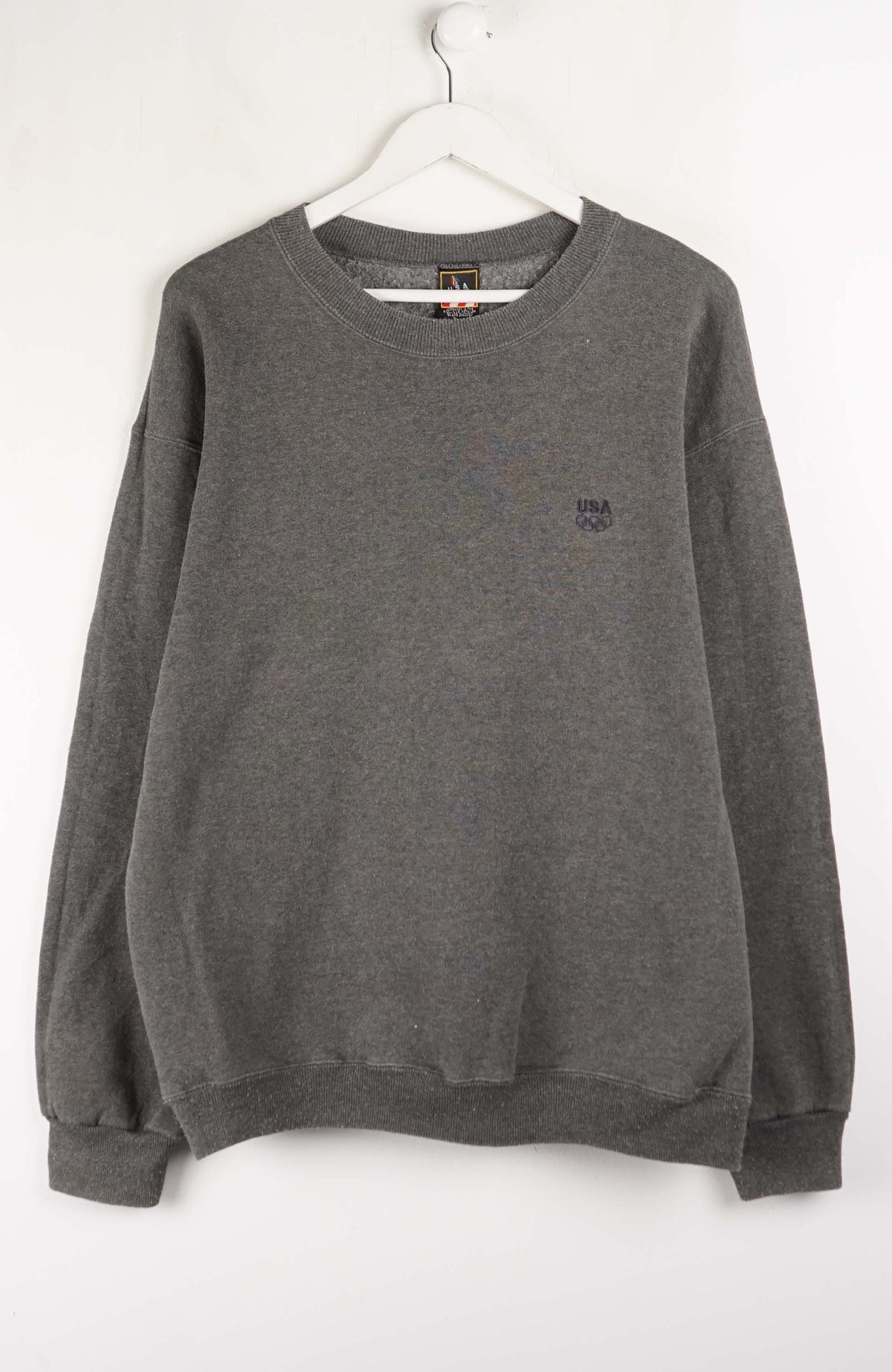 Gray sweatshirt with a small logo on a white background