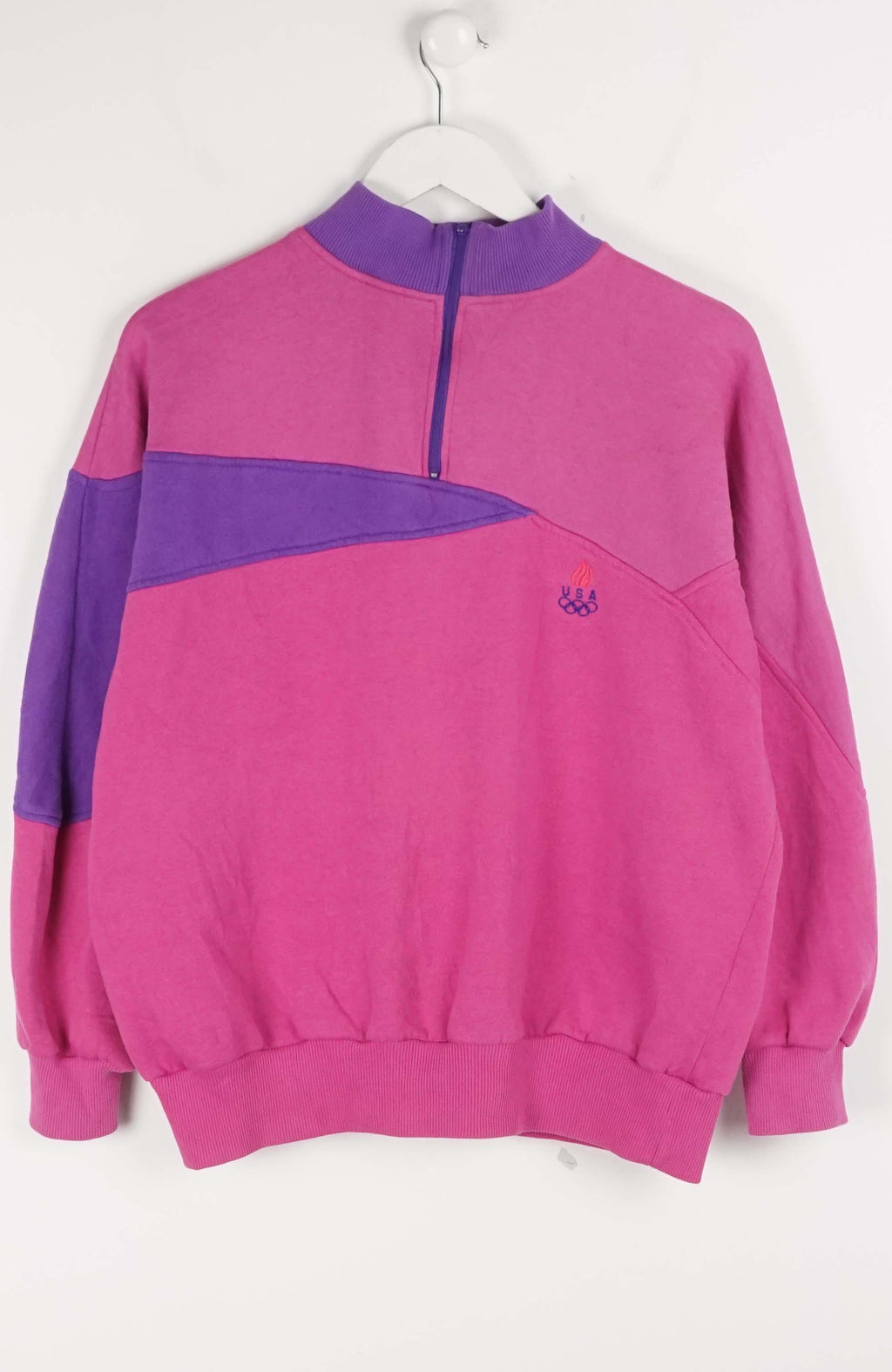 Pink and purple half-zip sweatshirt on a white background