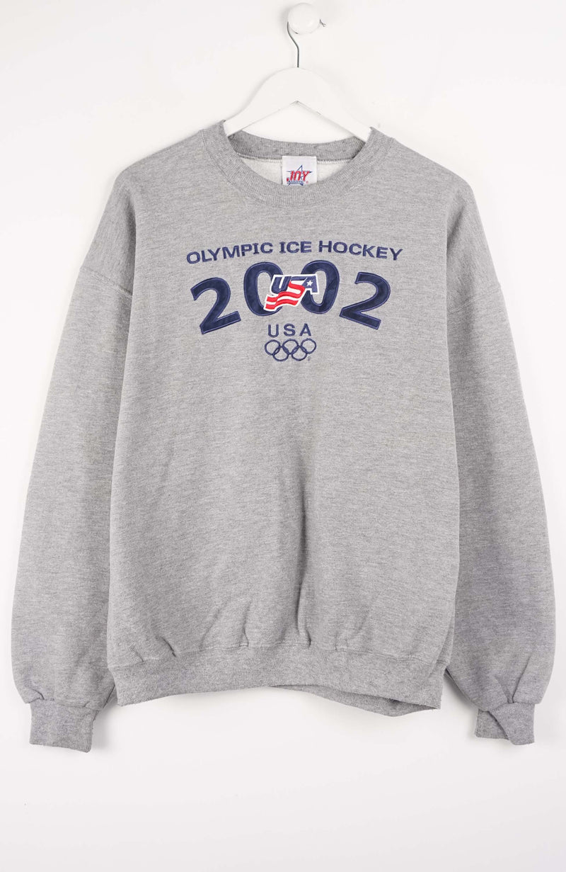 Gray sweatshirt with Olympic Ice Hockey 2002 USA text and logo on a white background