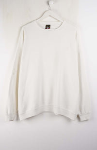 White sweatshirt on a hanger against a white background