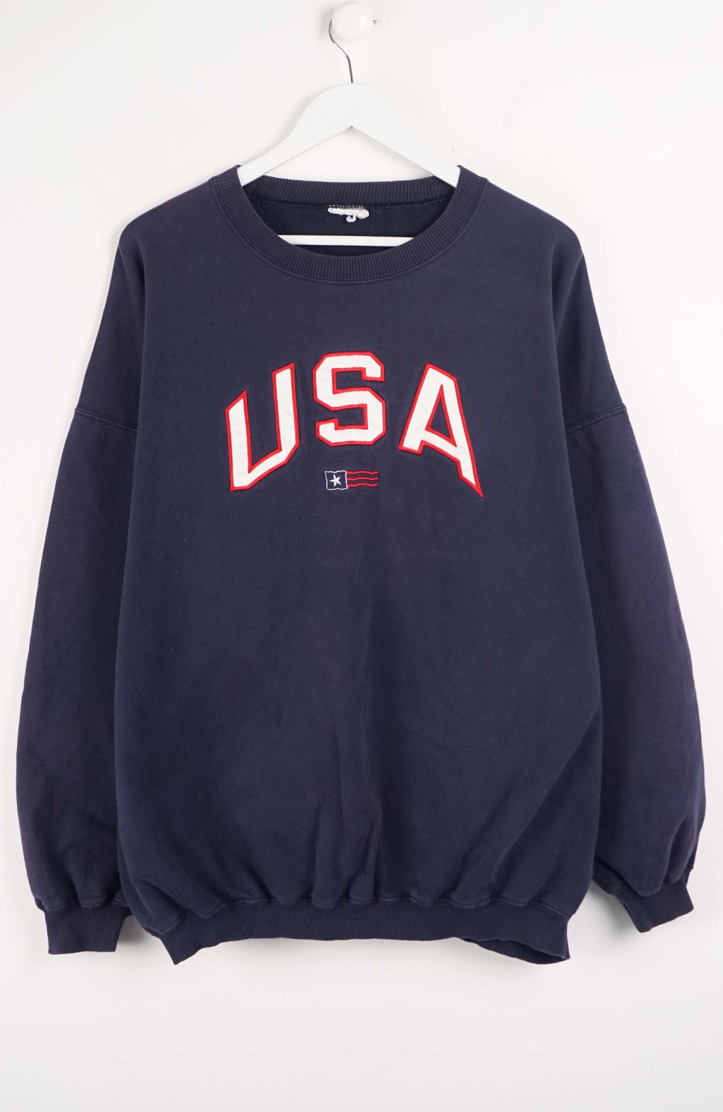 Navy blue sweatshirt with 'USA' printed in red on a white background