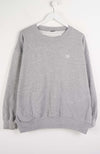 Gray sweatshirt with a small logo on a white background