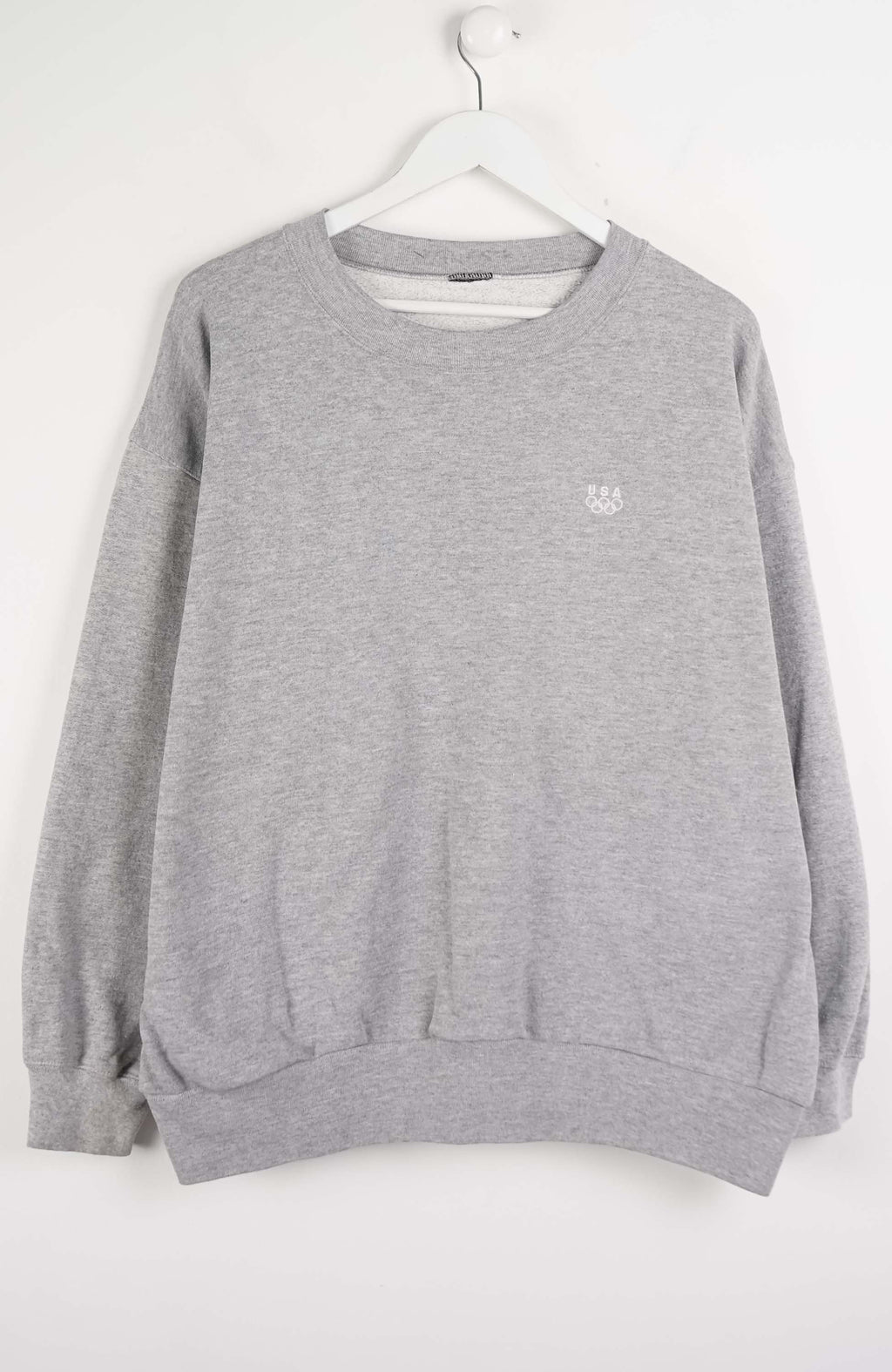 Gray sweatshirt with a small logo on a white background
