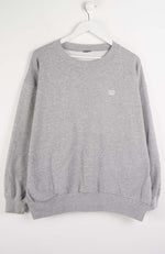 Gray sweatshirt with a small logo on a white background