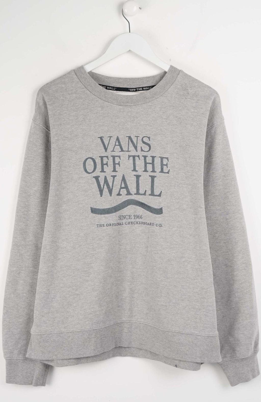 Gray sweatshirt with 'Vans Off The Wall' text on a white background