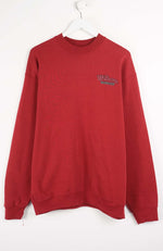Red sweatshirt with a logo on a white background