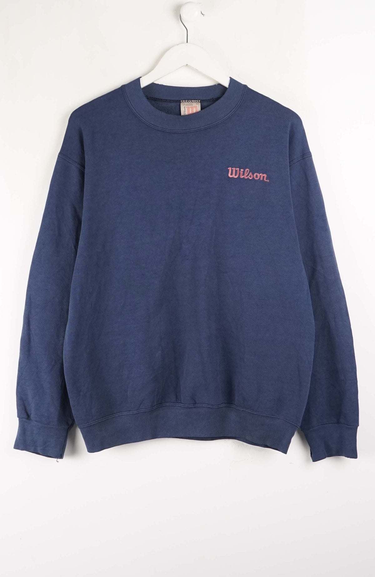 Blue sweatshirt with 'Wilson' logo on a white background