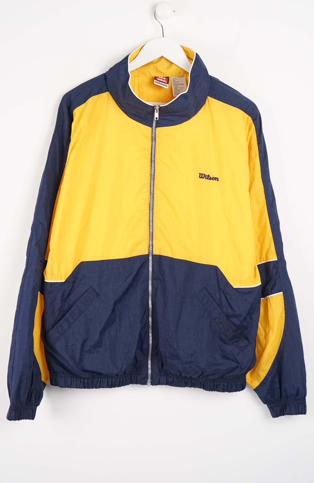 Yellow and navy jacket with Wilson logo on a white background