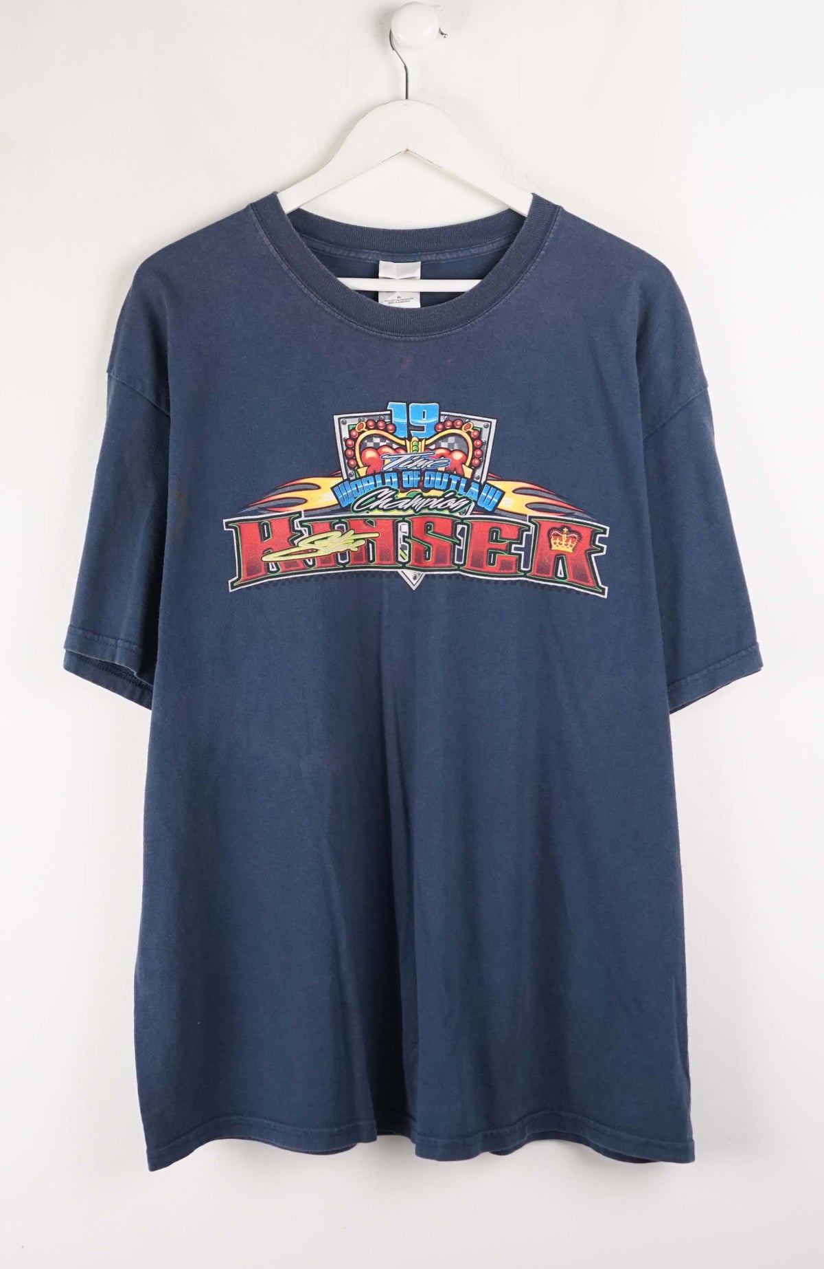 Blue t-shirt with colorful graphic design on a white background